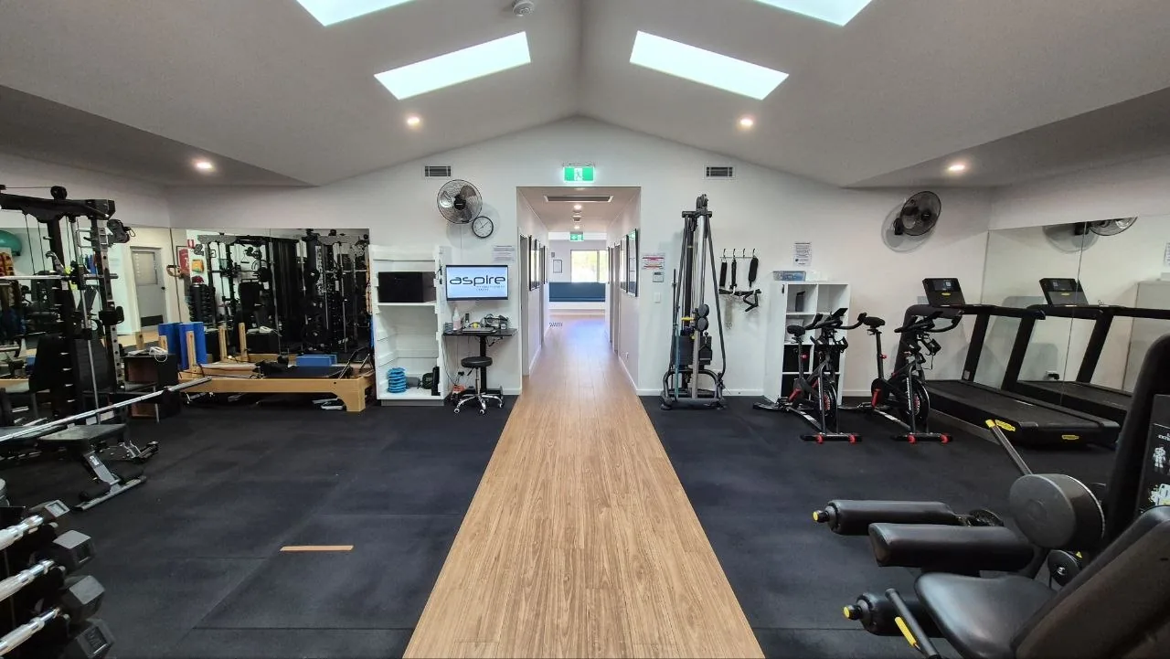 Aspire's private rehab gym with cardio and resistance equipment